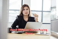 Small Business Owner Paying Taxes